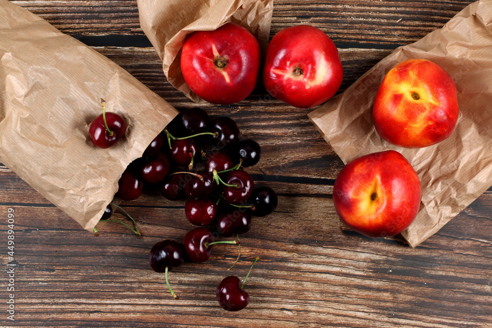 Canvas Prints Closeup of ripe cherries and nectarine peach. Top view.