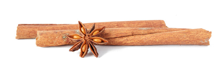 Cinnamon sticks and anise star isolated on white background