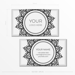 Business cards in white with black ornaments. Business card design with monogram patterns.