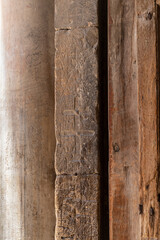 Carved  cross on a stone column at the entrance to the Church of the Holy Sepulcher in Christian quarters in the old city of Jerusalem, Israel