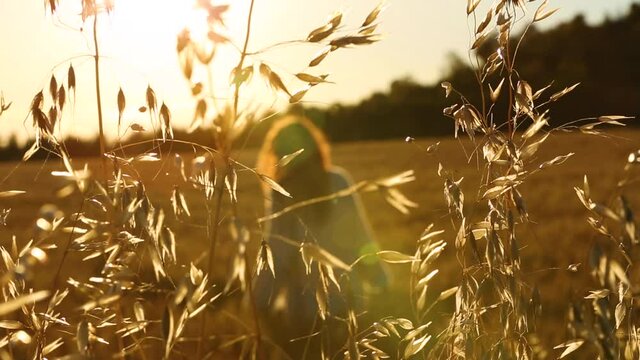 Young woman among summer cereal fields in Igualada, Barcelona, Spain