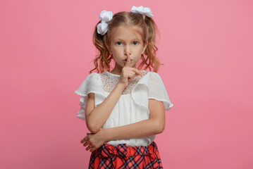 portrait of a cute schoolgirl with different emotions Isolated on pink background