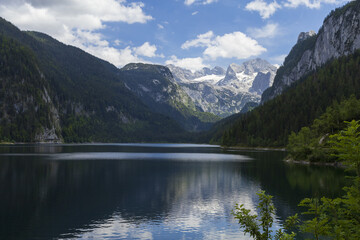 Gosau lake surrounded by Nothern Austrian Alps with Hoher Dachstein mountains view and reflection in summer sunny day
