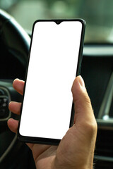 Young man holding his phone inside the car. mockup phone