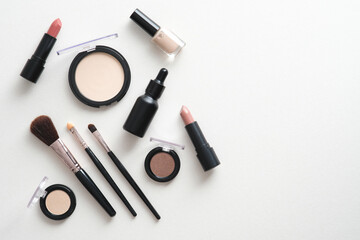 Fashion makeup cosmetic accessories on white background. Flat lay, top view.