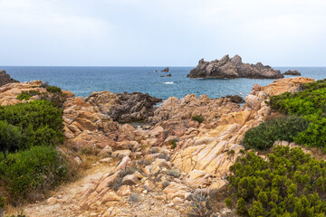 Fototapeta na wymiar beautiful beach and characteristic reddish rocks of Cala Caneddi, Costa Paradiso. Trinità d'Agultu e Vignola, Sardinia, Italy, Europe