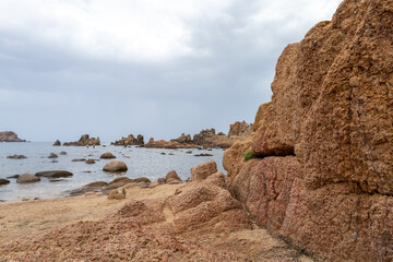 Fototapeta na wymiar beautiful beach and characteristic reddish rocks of Cala Caneddi, Costa Paradiso. Trinità d'Agultu e Vignola, Sardinia, Italy, Europe