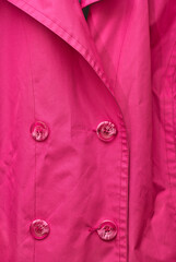 Stylish pink coat and buttons detail