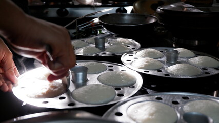 Fresh steamed Indian Idly (Idli / rice cake), traditional breakfast of South India