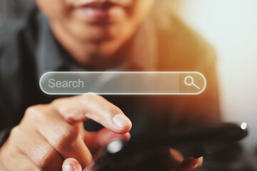 Man use smartphones to find what they are interested in. Searching information data on internet networking concept
