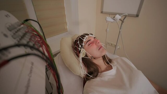 Patient brain testing using encephalography at medical center