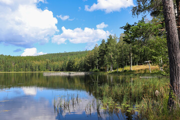 Fototapeta na wymiar Lake Kramstatjärn in the forest, Järvsö