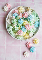 Small colorful meringues in the ceramic  bowl