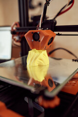 Plastic model on 3D printer in studio