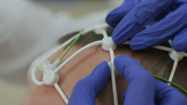 Patient brain testing using encephalography at medical center