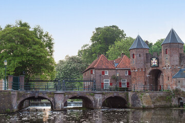 Fototapeta na wymiar Old bridge over the river Eem at the historic Koppelpoort in the medieval city of Amersfoort; Netherlands.