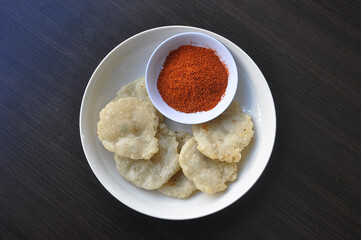 cireng with chili powder seasoning.
Cireng is a traditional Indonesian food made from tapioca flour, seasoned with spices such as garlic, salt, pepper and cooked by frying