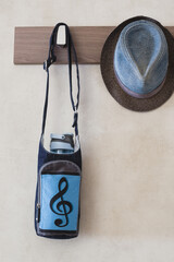 Denim hat and denim women bag on the hook of the hanger in the hallway - fashionable women accessories