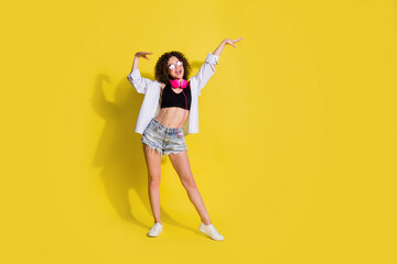 Full length body size photo of girl wearing stylish clothes dancing at party in summer isolated vibrant color background
