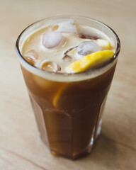 Professional cocktails with ice, lemon and alcohol - refreshing soft drinks from the bartender - the art of mixing liquids