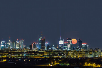 Fototapeta na wymiar Moonrise over Warsaw, capital of Poland