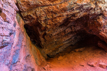 Small Cave Formed In The Red Limestome Walls of Condor Canyon, Panaca, Nevada, USA