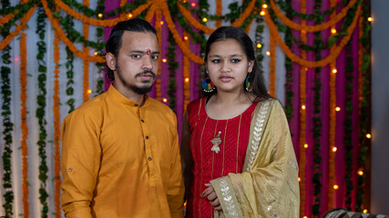 Indian children wearing ethnic Indian dress during Raksha Bandhan, a festival to celebrate the bond between brother-sister. Decoration in Indian houses.