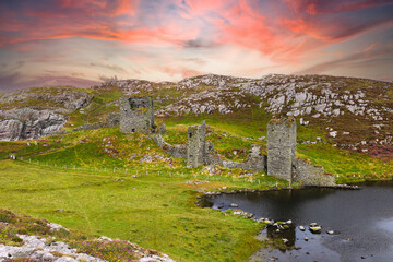 Fototapeta na wymiar Dun Lough castle, Dun a Locha, the fort of the lake, is perched on the edge of 100 metre cliffs on the western headland above the Mizen Head in west cork, Ireland