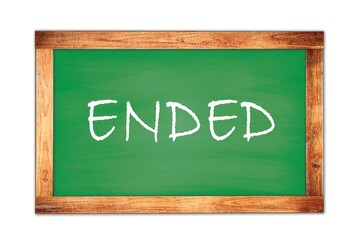 ENDED text written on green school board.