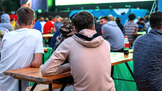 People watching football in a public place