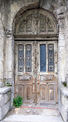Fototapeta premium Entrance into an old abandoned residential building