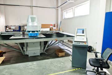 Mechanical technician operative of milling cutting machine center at tool workshop.