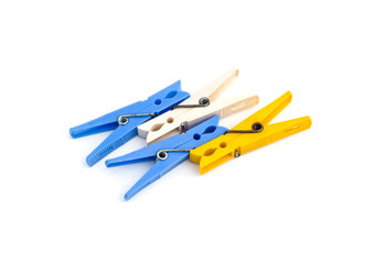 A bunch of decorative different color clothespins on an isolated white background