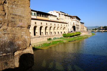 View of the buildings on the river Arno bank from the Old Bridge (Ponte Vecchio). Florence, Italy.