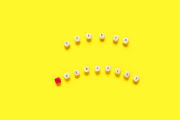 Cubes with text SPEECH THERAPIST on color background