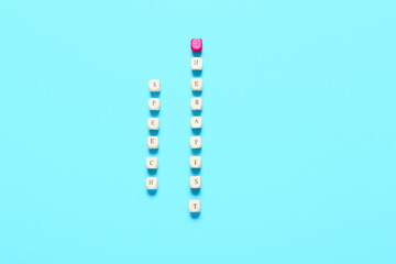 Cubes with text SPEECH THERAPIST on color background