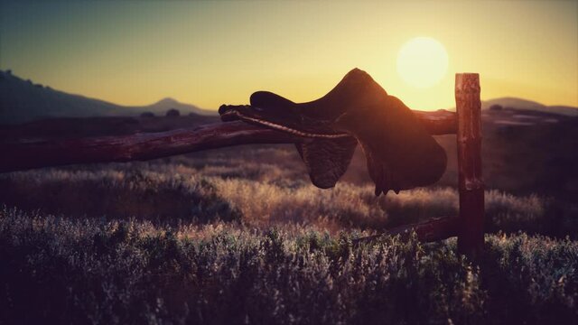 old saddle as the sunset in the country