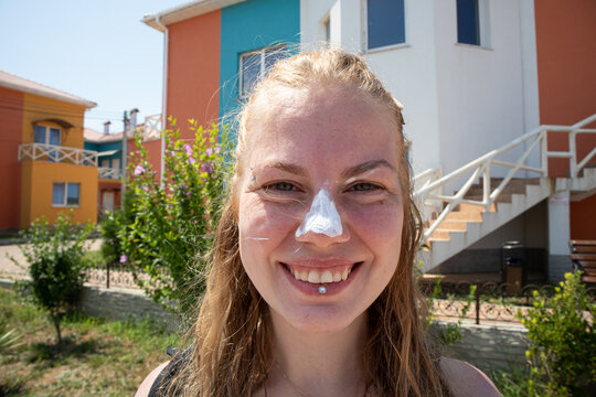 Girl With Sunscreen On Her Nose Smile Close Up