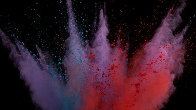 Super slow motion shot of color powder explosion isolated on black background. Shot with high speed cinema camera at 1000fps