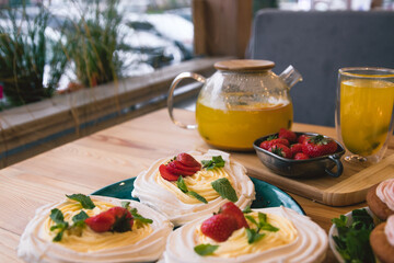 Meringue and whipped cream dessert layered with seasonal strawberry.