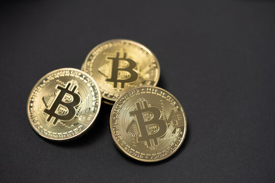 Gold Bitcoin coins on Black Background, Copyspace. Crypto Currency coins