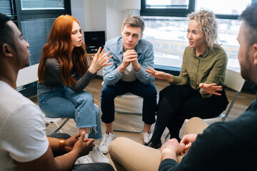 Young group of multiethnic business people share ideas during brainstorming on background of...