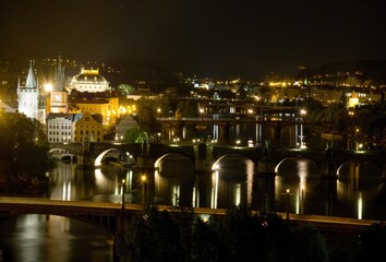 National Theater and bridges over the Vltava river in Prague at night