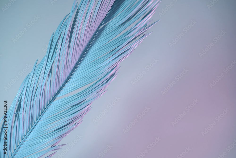 Poster beautiful palm leaf in neon light. minimalism retro style concept. background pattern texture for de
