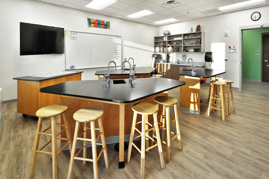 Modern school science lab classroom with barstool seating