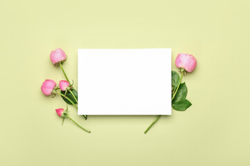 Blank card and beautiful peony roses on color background