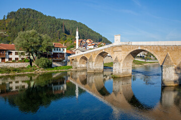 Fototapeta na wymiar Historical arched bridge in the old town Konic, Bosnia and Herzegovina