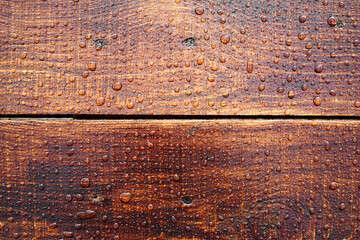 Beautiful old wooden surface, covered with raindrops. Beautiful background. Top view.