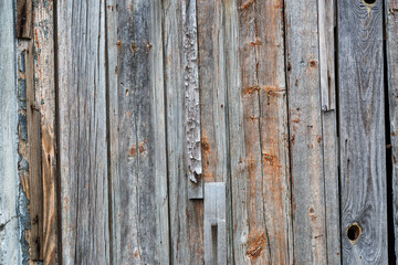 Old wooden fence gray-brown boards with cracked. Beautiful textured background for design.Old Vintage Rough Wood Bars Fence Texture Background.