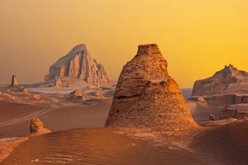 Papier Peint photo Lavable Orange Lut desert with tall rock formations known as Kaluts in Iran
